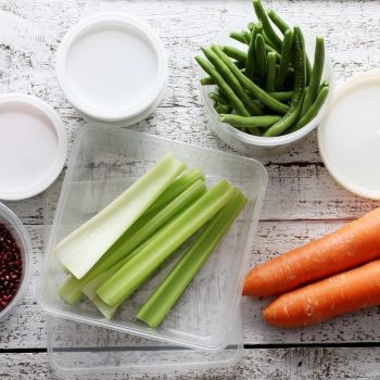 Plastic Containers on Wooden Background